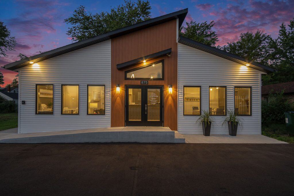 Modern West Michigan home with contemporary design, energy-efficient windows, and stylish exterior lighting, perfect for buyers seeking quality real estate in West Michigan.