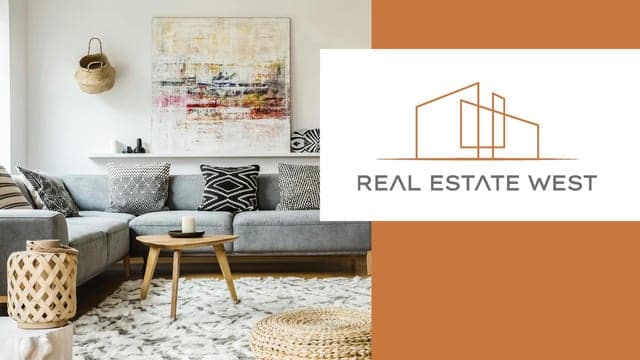 Elegant living room with modern decor, plush sofa, and abstract artwork, showcasing West MI real estate styling and interior design services offered by Real Estate West.
